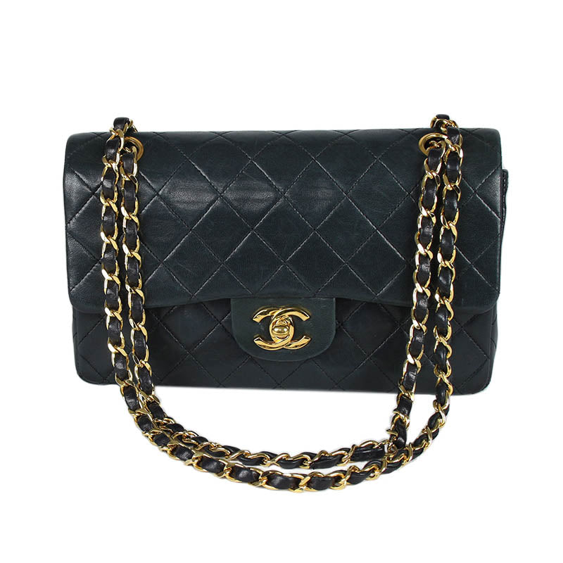 Chanel small classic navy double flap with gold tone hardware and double chain.