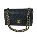 Chanel small classic navy double flap with gold tone hardware and double chain.