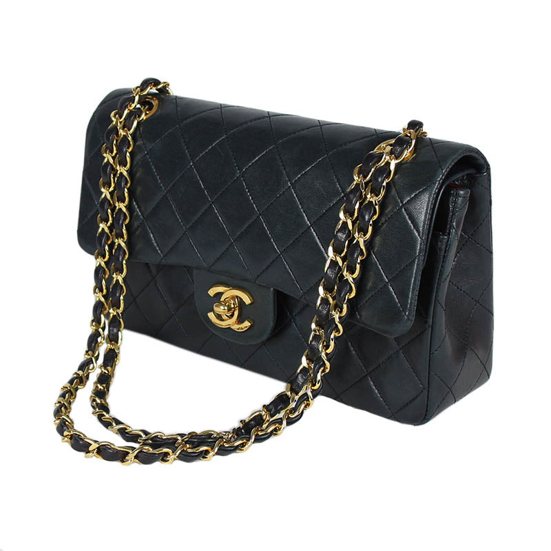 Chanel small classic navy double flap with gold tone hardware and double chain.