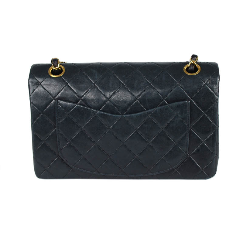 Chanel small classic navy double flap with gold tone hardware and double chain.