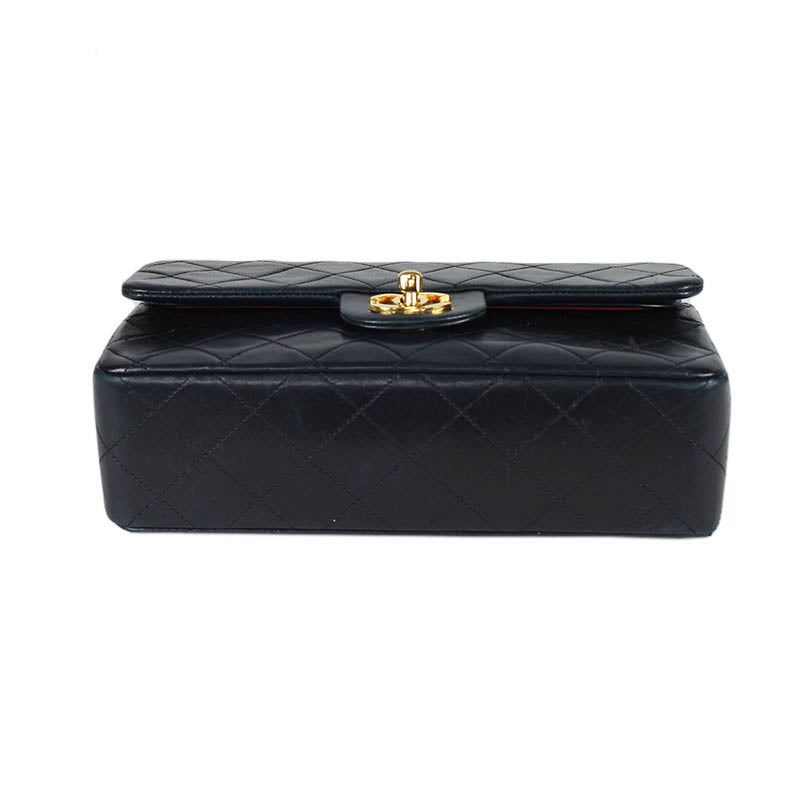 Chanel small classic navy double flap with gold tone hardware and double chain.