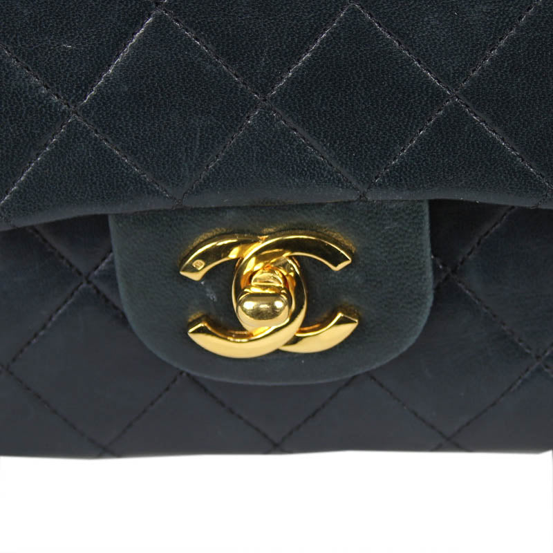 Chanel small classic navy double flap with gold tone hardware and double chain.