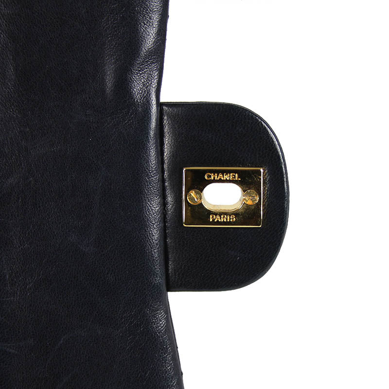 Chanel small classic navy double flap with gold tone hardware and double chain.