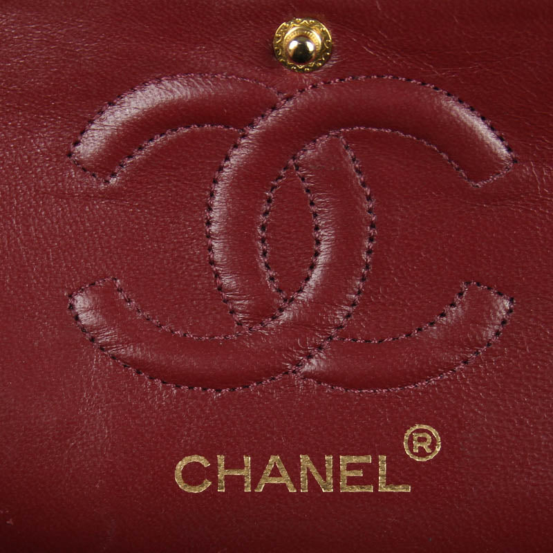 Chanel small classic navy double flap with gold tone hardware and double chain.