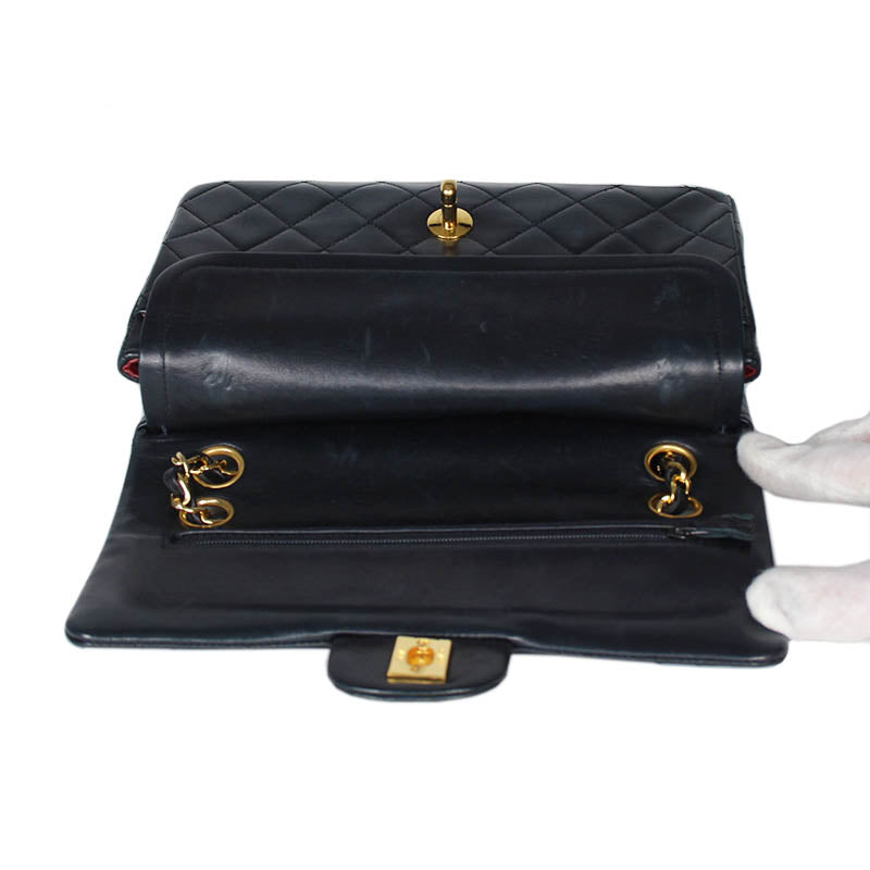Chanel small classic navy double flap with gold tone hardware and double chain.