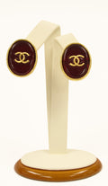 Chanel red ear clips with gold tone "cc"